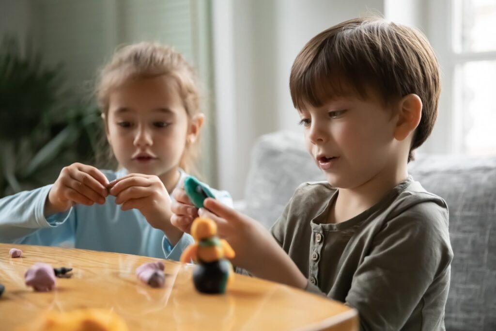 two young children with autism playing together