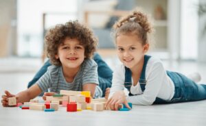 boy and girl with autism playing