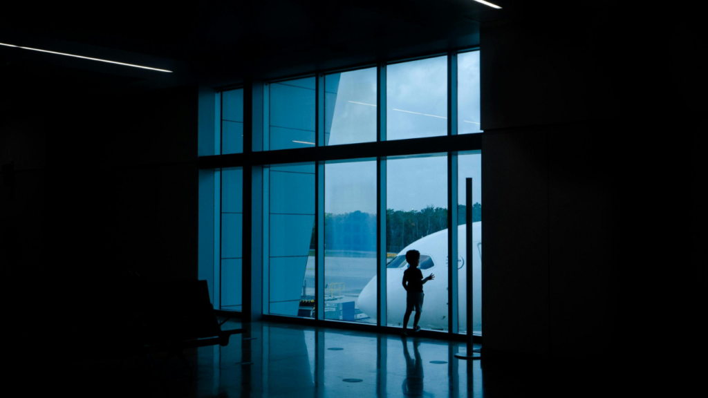 child getting ready to travel at the airport