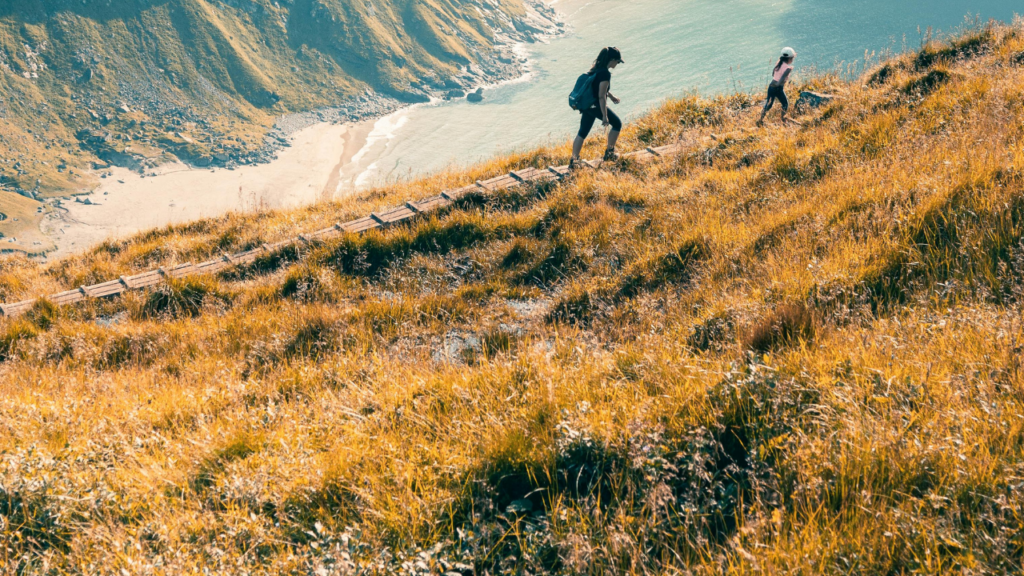 Parent and autistic child hiking in the mountains